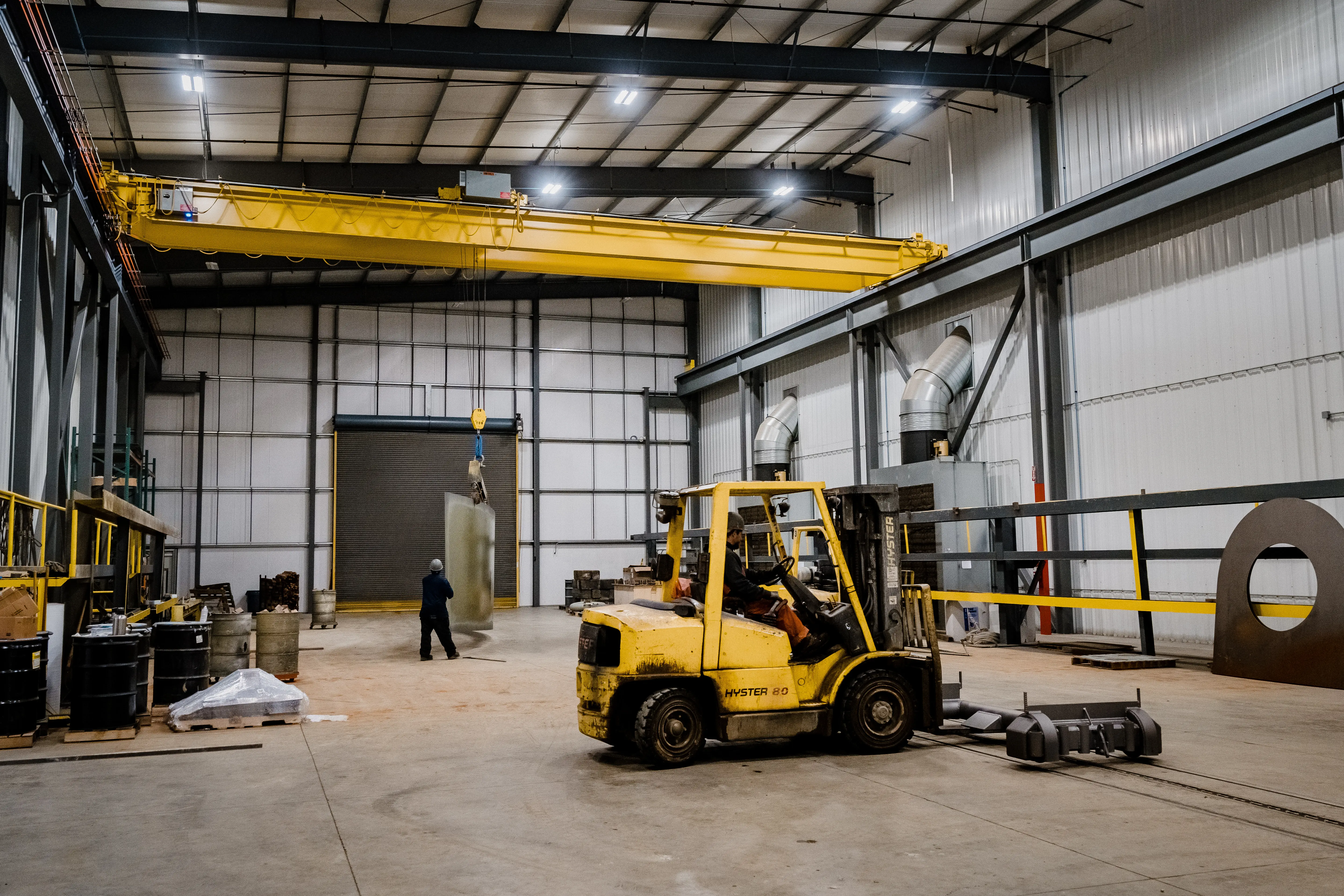 A man driving a forklift for surface preparation solutions ready to transport
