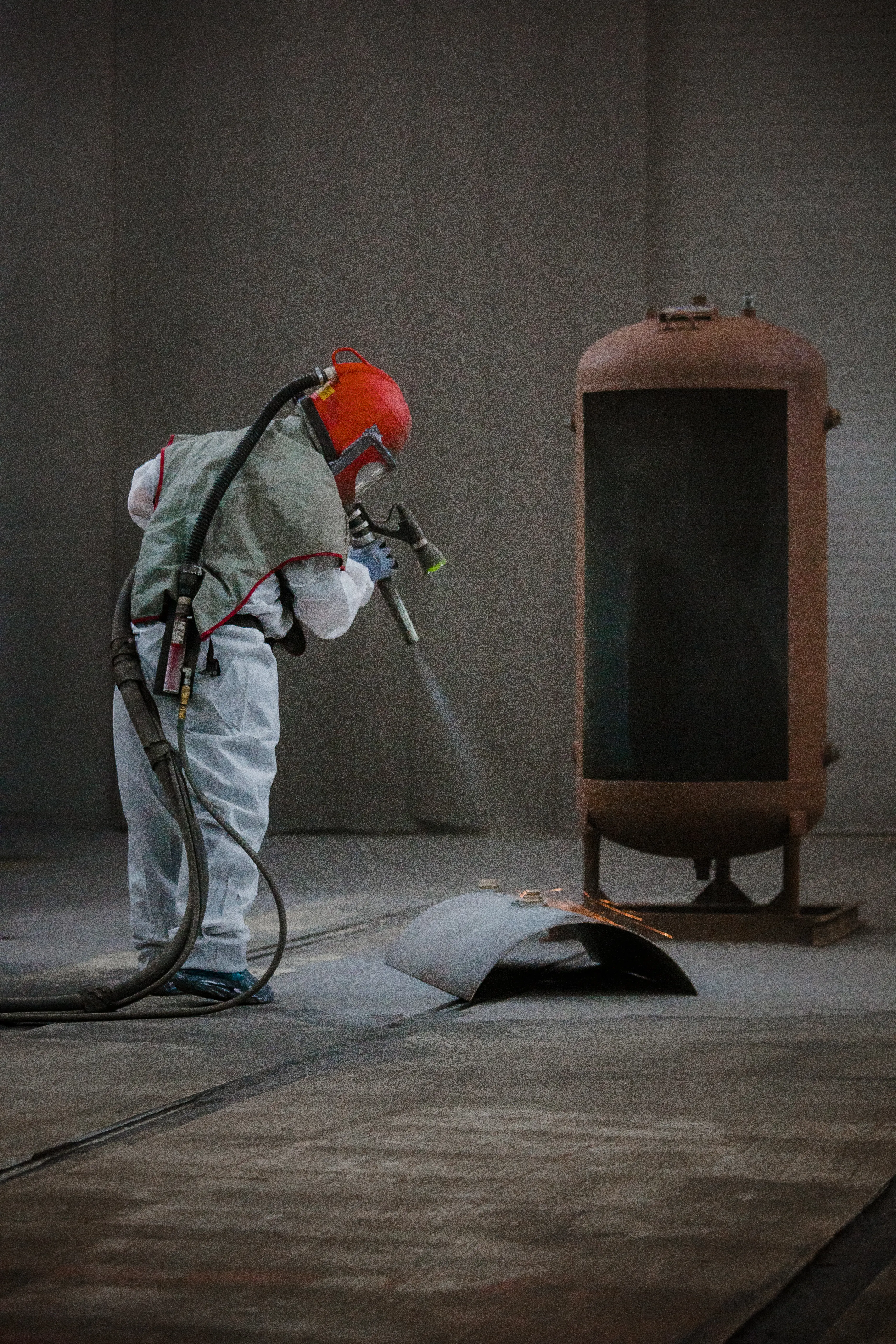 A man wearing a white coat working industrial coating
